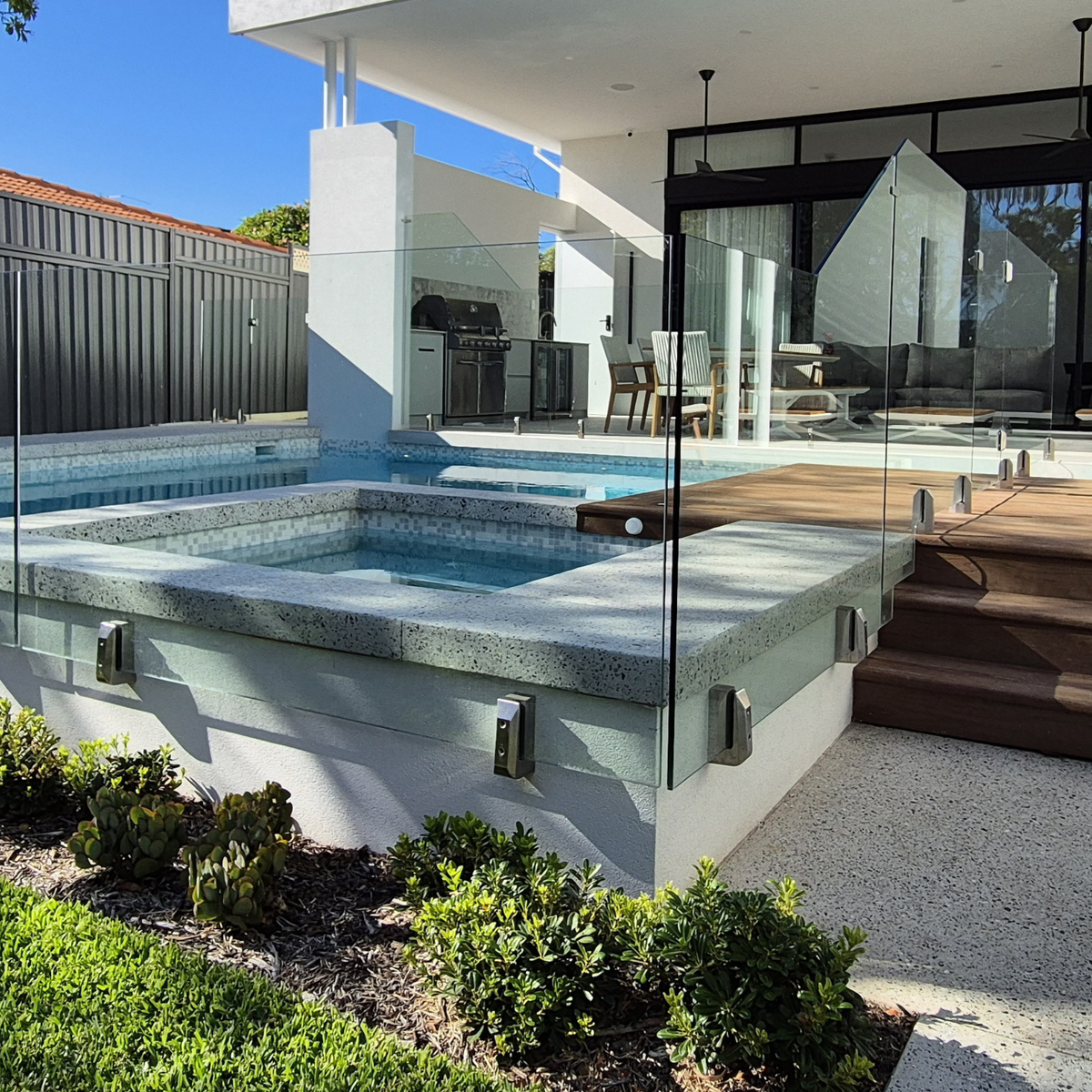surface spigot glass railing on concrete
