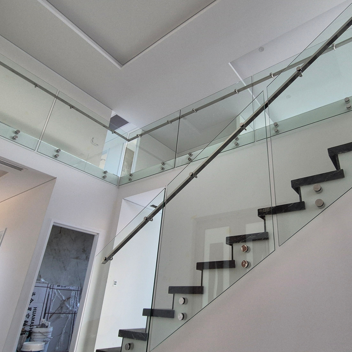 standoff pin glass railing on stair